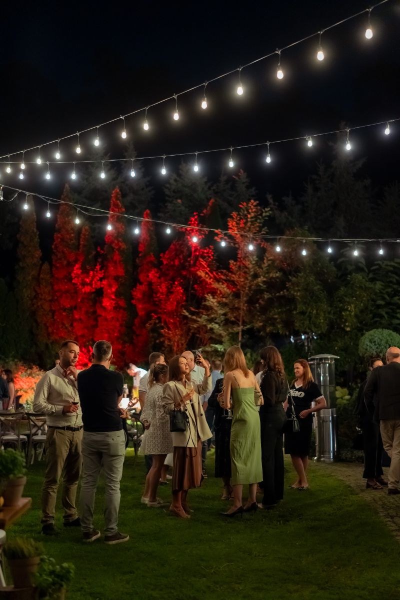 Evening celebration beneath festoon lights