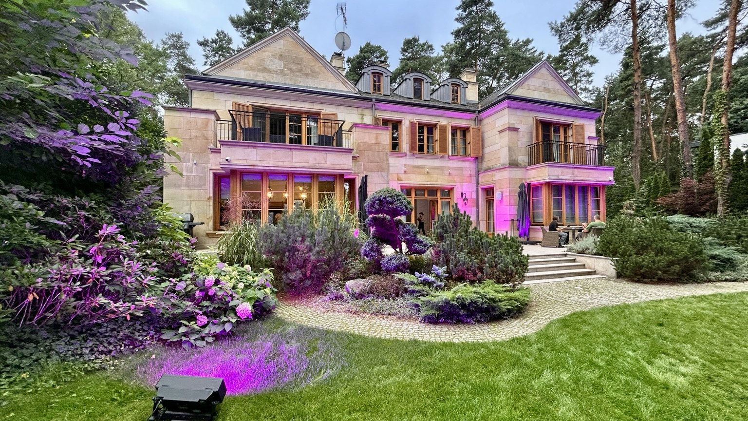 Villa and garden with purple lighting