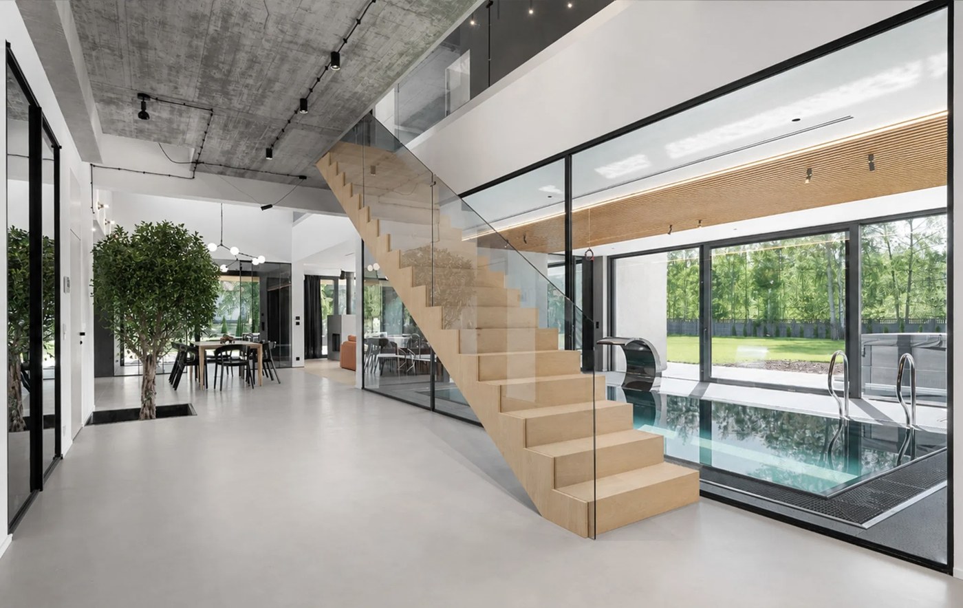 Wooden staircase and glazed pool area