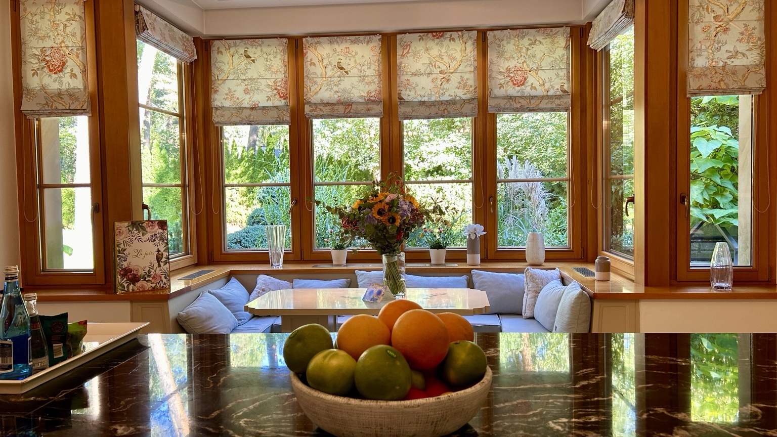 Bright kitchen and dining nook overlooking a garden