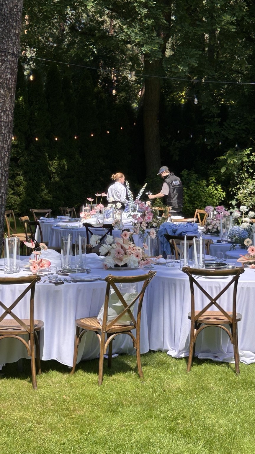 Round wedding tables in a green garden